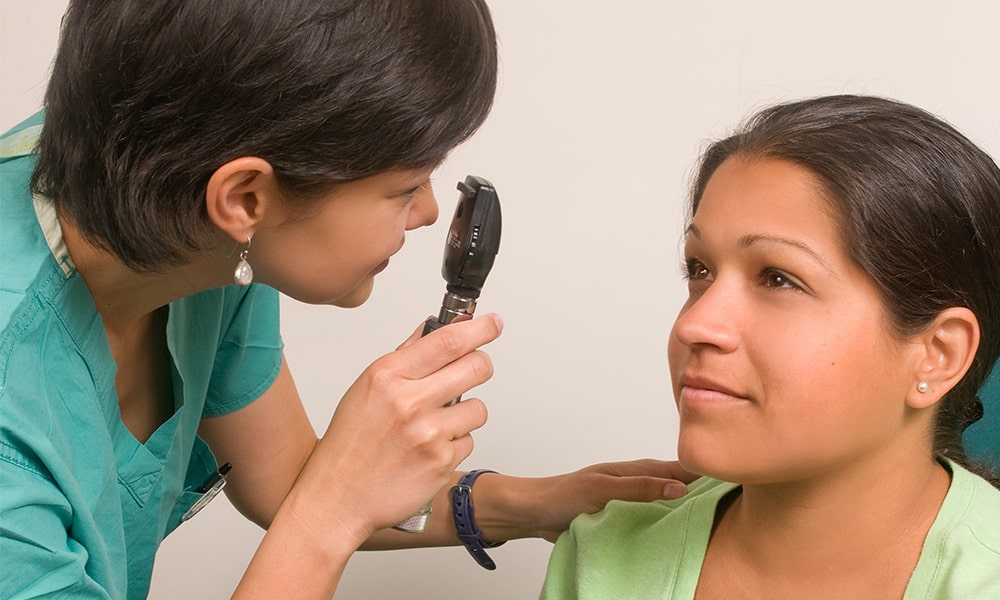 eye doctor examining the patient's eye