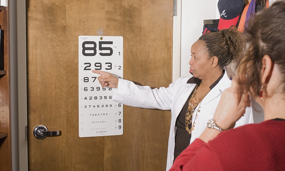 ophthalmologist pointing to letters