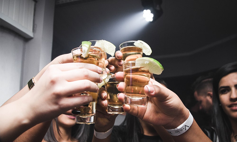 young people toast with alcohol